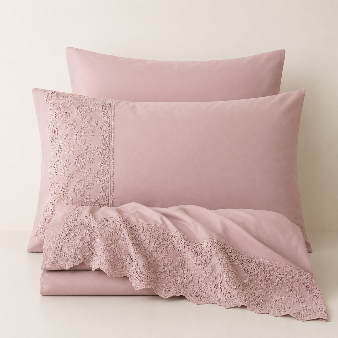 Light mauve cotton percale sheet set styled on bed